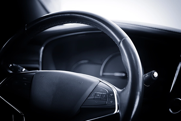 Close-up of steering wheel in car interior